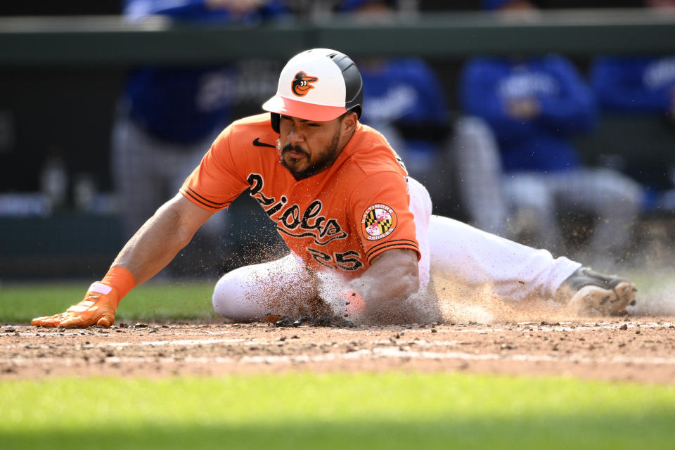 Baltimore Orioles' Anthony Santander slides home to score on a single by Austin Hays during the fifth inning of a baseball game against the Kansas City Royals, Saturday, June 10, 2023, in Baltimore. (AP Photo/Nick Wass)