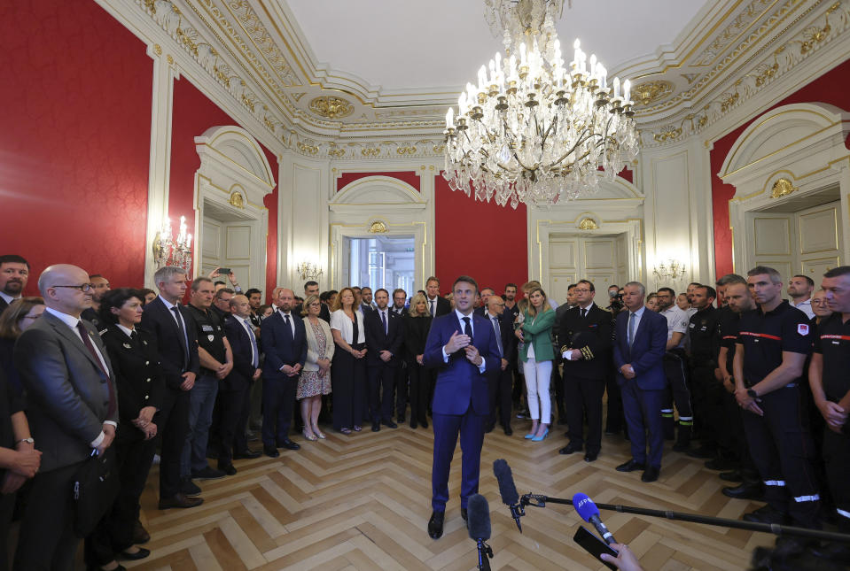 French President Emmanuel Macron delivers a speech as he meets rescue forces in Annecy, French Alps, Friday, June 9, 2023. A man with a knife stabbed four young children at a lakeside park in the French Alps on Thursday June 8, 2023, assaulting at least one in a stroller repeatedly. Authorities said the children, between 22 months and 3 years old, suffered life-threatening injuries, and two adults were also wounded. (Denis Balibouse/Pool via AP)