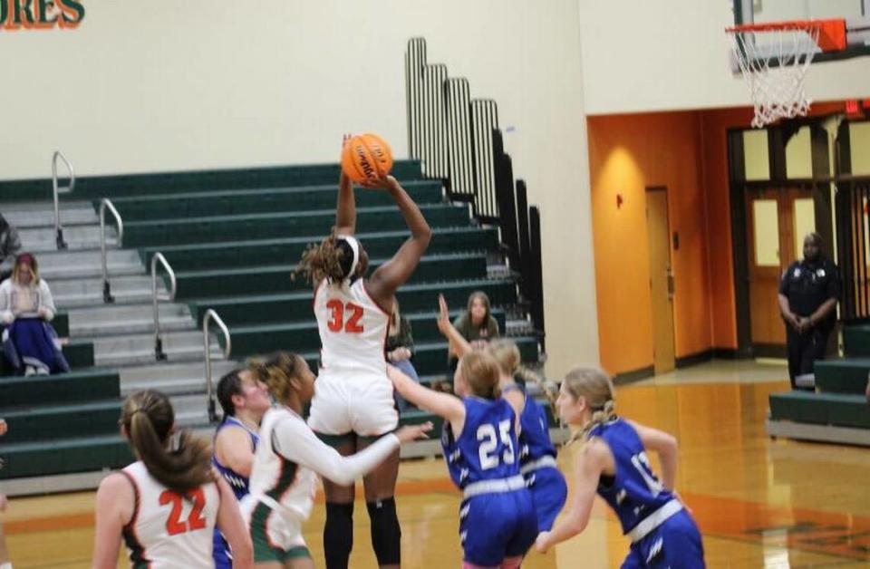 West Harrison forward Taylor Hopgood goes up for a shot during a game.
