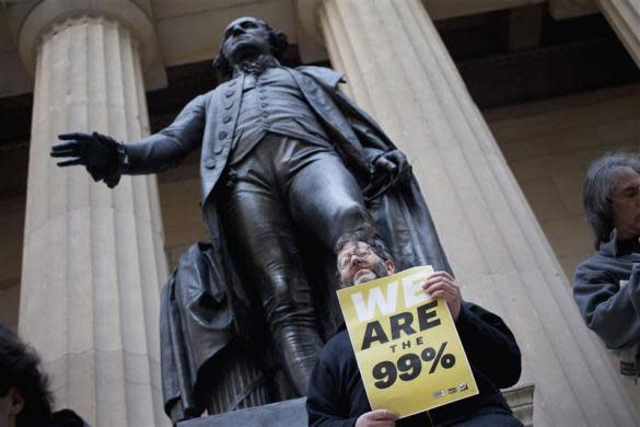 An Occupy Wall Street protestor stands on the steps of Federal Hall in the financial district in New York March 30, 2012. According to organizers, the focus of the day was "spring training," and included teaching people how to lead a march, handle law enforcement and resist arrest.