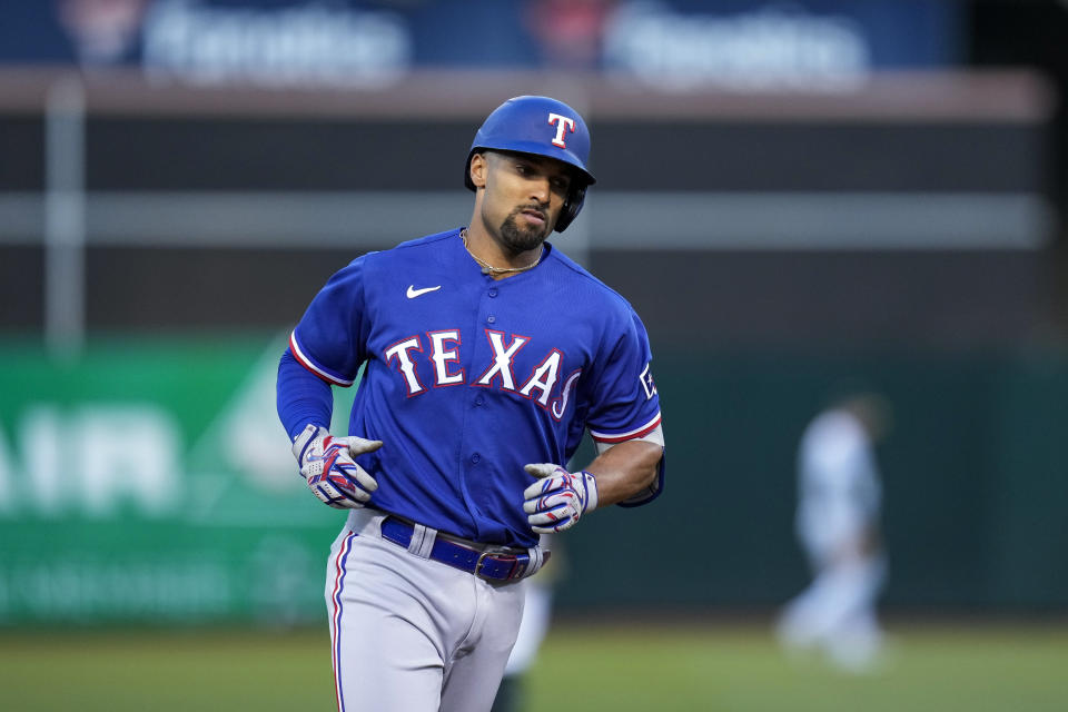 Texas Rangers' Marcus Semien runs the bases after hitting a solo home run against the Oakland Athletics during the sixth inning of a baseball game in Oakland, Calif., Thursday, May 11, 2023. (AP Photo/Godofredo A. Vásquez)