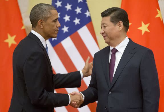 In this Nov. 12, 2014 file photo, President Barack Obama shakes hands with Chinese President Xi Jinping after their joint conference on climate change in Beijing.