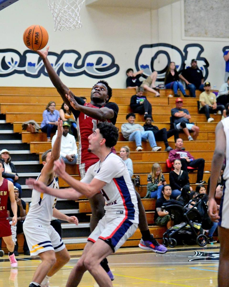 Pattersons David Naji jumps for a layup over multiple defenders during the 27th Annual Six County All Star Senior Basketball Classic Boys game at Modesto Junior College in Modesto California on April 27, 2024. The Red team beat the Blue team 81-79.