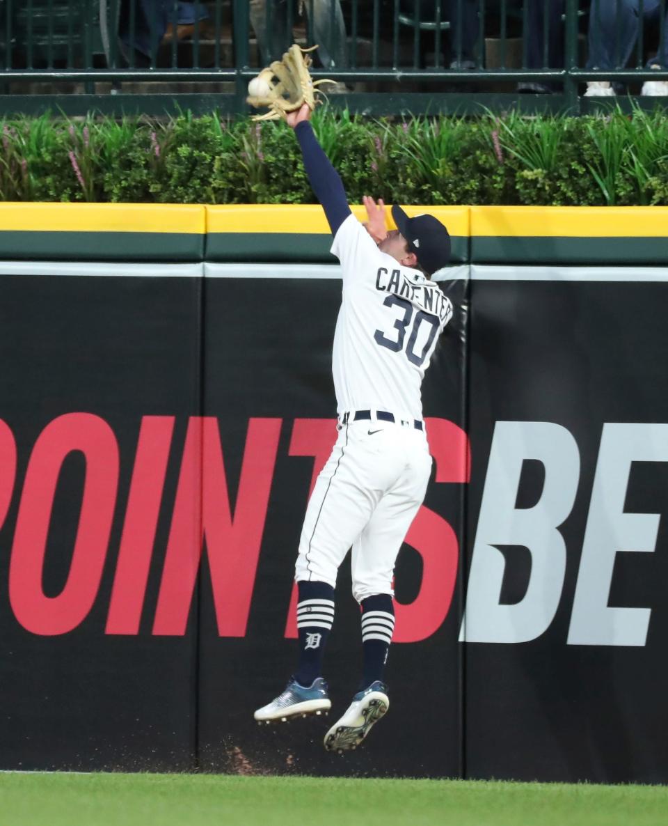 Detroit Tigers right fielder Kerry Carpenter (30) catches a fly ball by Baltimore Orioles first baseman Ryan Mountcastle (6) during sixth inning action Thursday, April 27, 2023. Carpenter left the game after hitting the wall on the catch.