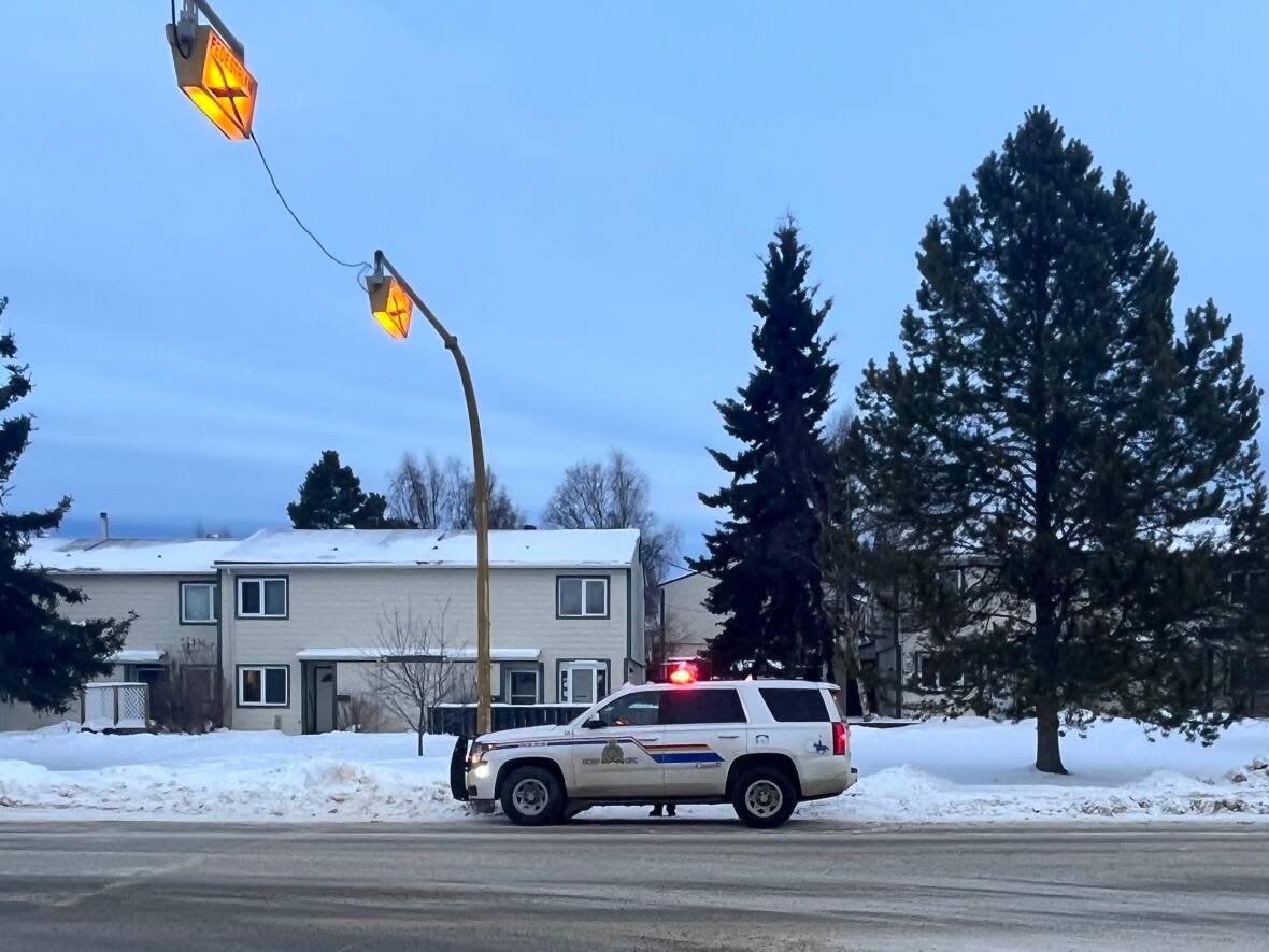 An RCMP vehicle in the Riverdale neighbourhood of Whitehorse on Friday. Police were executing a search warrant at a residence, related to an investigation into online meeting safety. (Leslie Amminson/RCMP - image credit)