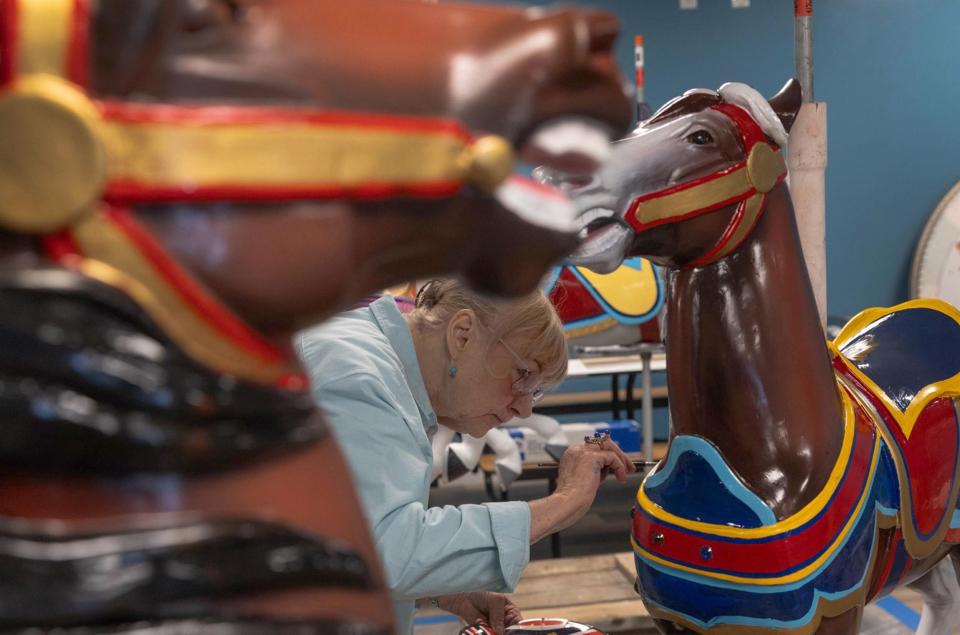 Marie DeSaules repaints several of the Seaside Heights carousel horses for the refurbishment. She also worked on the project decades ago when most of the horses were repainted. 07/23/23