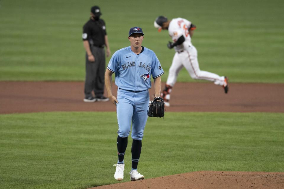 Toronto Blue Jays starting pitcher Nate Pearson stands on the pitching mound after Baltimore Orioles' Anthony Santander hit a two-run home run during the first inning of a baseball game, Tuesday, Aug. 18, 2020, in Baltimore. (AP Photo/Tommy Gilligan)