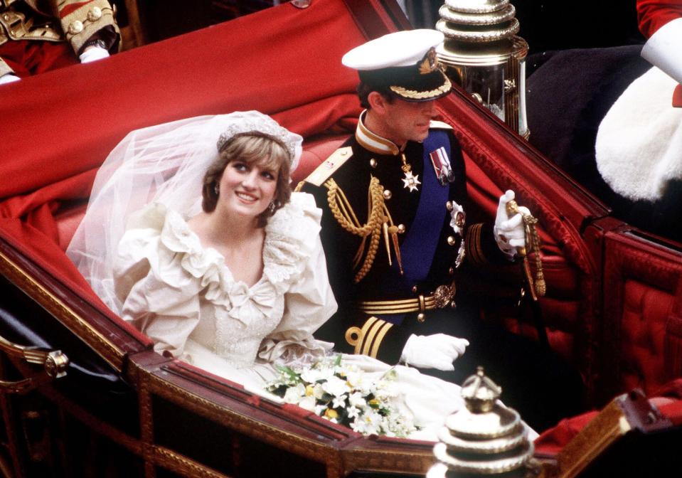The Prince and Princess of Wales return to Buckingham Palace by carriage after their wedding, 29th July 1981.