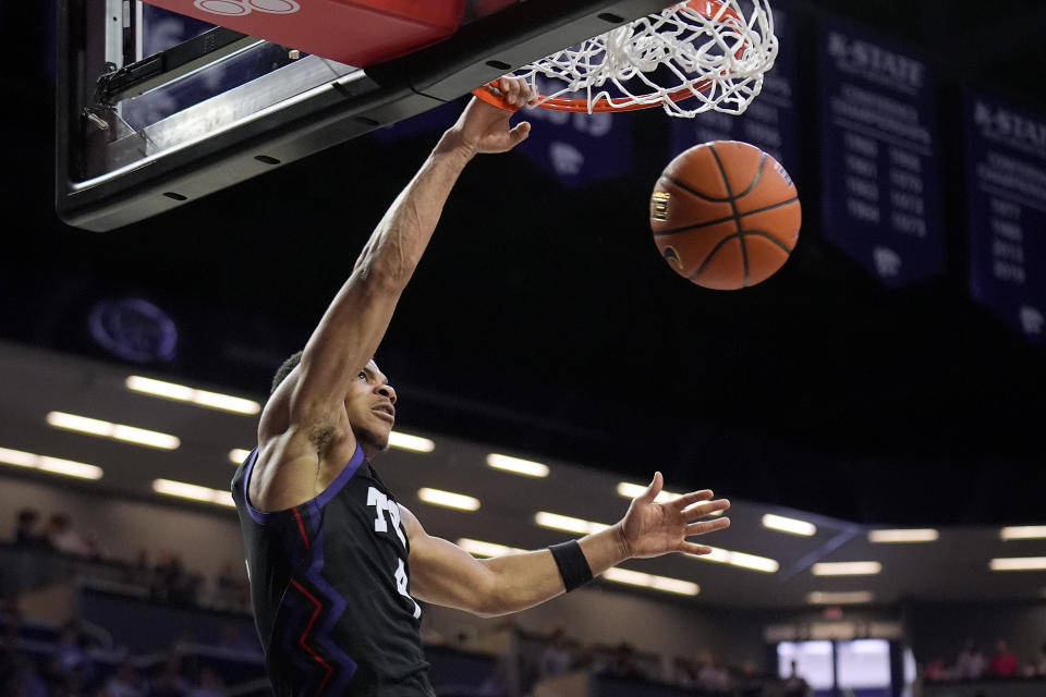 TCU guard Jameer Nelson Jr. dunks the ball during the first half of an NCAA college basketball game against Kansas State Saturday, Feb. 17, 2024, in Manhattan, Kan. (AP Photo/Charlie Riedel)