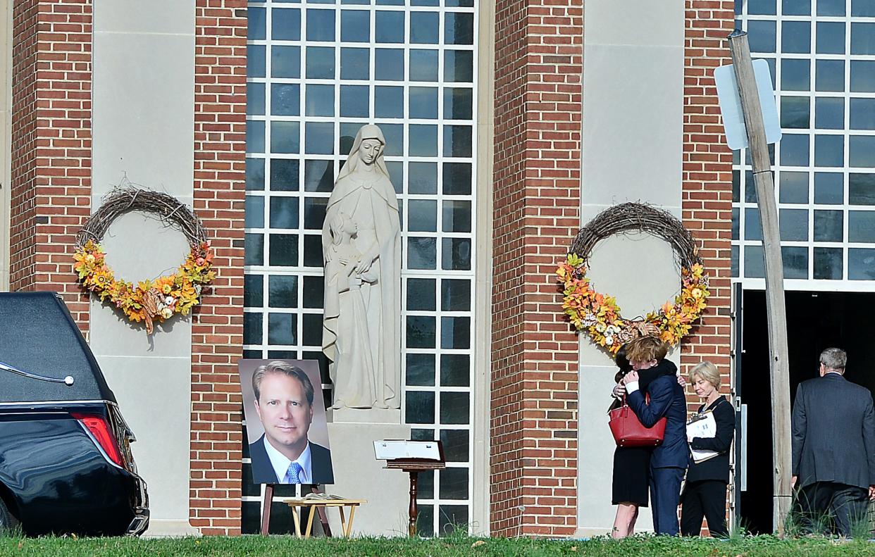 Family, friends and members of the community attend the funeral for Washington County Circuit Judge Andrew F. Wilkinson on Friday at St. Ann Catholic Church in Hagerstown.