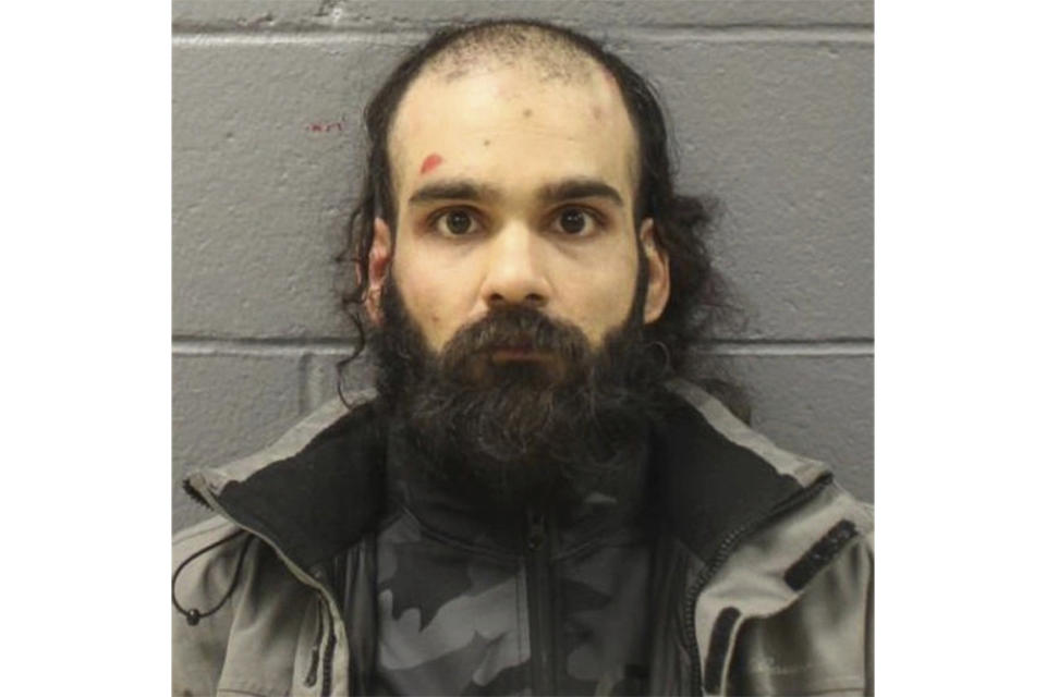 This booking photo provided by Massachusetts State Police on Tuesday, March 7, 2023, shows Francisco Severo Torres. Torres is scheduled to appear for a detention hearing in Boston federal court on Thursday, March 9, 2023, after being charged with trying to open an airliner's emergency door on a flight from Los Angeles to Boston and trying to stab a flight attendant in the neck with a broken metal spoon.(Massachusetts State Police via AP)