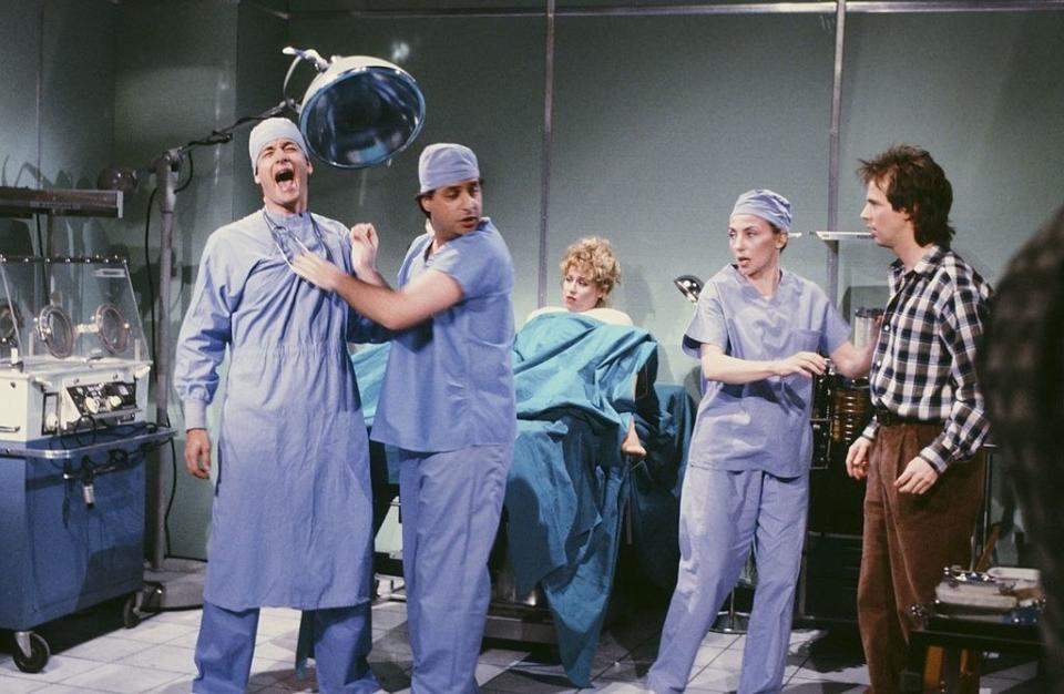 Tom Hanks as doctor, Jon Lovitz as doctor, Victoria Jackson as mother, Dana Carvey as father during the 'Delivery Room' skit