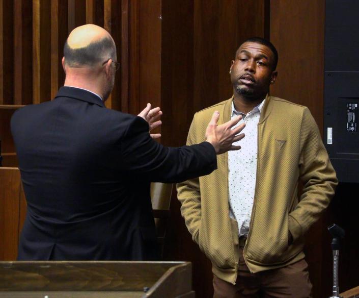 The special prosecutor, Gregory Winters of the Houston County District Attorney’s office, questions Torrance Terrell Menefee, facing camera, after Menefee took the witness stand in his Columbus murder trial Wednesday to explain why he shot his friend Kenneth Holloway Jr. during a 2016 argument over a bottle of liquor. 04/12/2023
