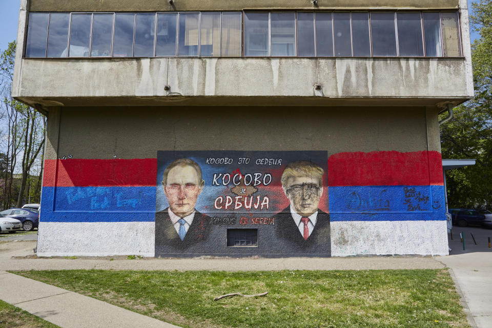 A mural of Russian President Vladimir Putin and US President Donald Trump is painted on April 14, 2017 in Belgrade, Serbia. The text reads 'Kosovo is Serbia'.