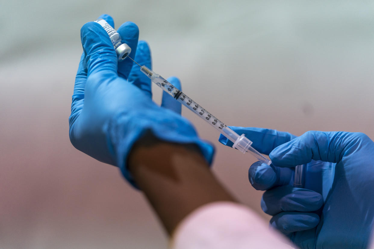 Pharmacist Diana Swiga fills a dead volume syringe with the Pfizer-BioNTech COVID-19 Vaccine at a pop-up COVID-19 vaccination site at the Bronx River Houses Community Center on Jan. 31, 2021, in the Bronx borough of New York. (Mary Altaffer/AP)