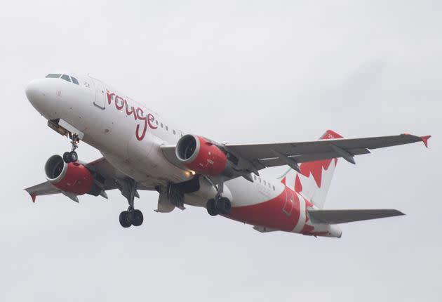 An Air Canada Rouge jet takes off at Montreal's Trudeau International Airport on March 20, 2020, as coronavirus infections rise in Canada and around the world.