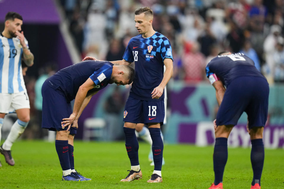Croatian players react following the World Cup semifinal soccer match between Argentina and Croatia at the Lusail Stadium in Lusail, Qatar, Tuesday, Dec. 13, 2022. (AP Photo/Petr David Josek)