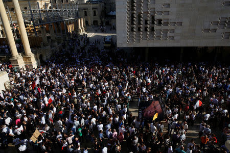 People protest against the assassination of investigative journalist Daphne Caruana Galizia last Monday, in Valletta, Malta, October 22, 2017. REUTERS/Darrin Zammit Lupi