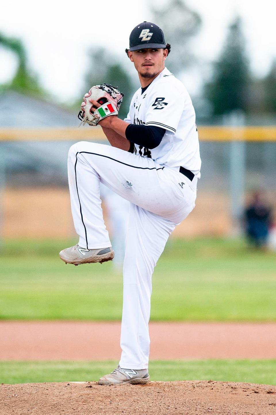 Buhach Colony sophomore Erik Munoz (14) winds up before throwing a pitch during a game against Golden Valley at Buhach Colony High School in Atwater, Calif., on Thursday, May 4, 2023.