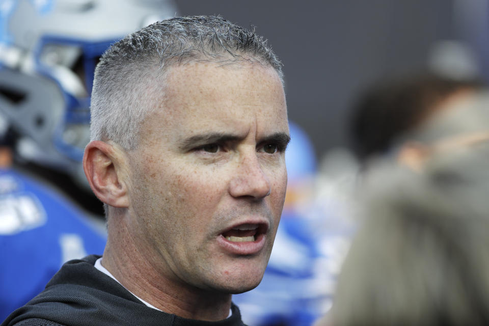 Memphis head coach Mike Norvell watches as players warm up before the start of an NCAA college football game against Cincinnati for the American Athletic Conference championship Saturday, Dec. 7, 2019, in Memphis, Tenn. (AP Photo/Mark Humphrey)