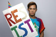 <p>Jao Belanders, 22, poses for a portrait during the Resist March against President Donald Trump in West Hollywood, California, U.S., June 11, 2017. Belanders said: “Why so much hate? It baffles me how someone can have so much hate in their heart and inequality and think that’s OK and that’s power. As president, he should be a leader who inspires hope and change for the better and not influence people to think negatively of other people. It breaks my heart to see that.” (Photo: Lucy Nicholson/Reuters) </p>