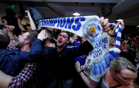 Britain Football Soccer - Leicester City fans watch the Chelsea v Tottenham Hotspur game in pub in Leicester - 2/5/16. Leicester City fans celebrate winning the Premier LeagueReuters / Eddie Keogh Livepic