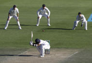 Sri Lanka's Kusal Mendis ducks under a bouncer during play on day three of the first cricket test between New Zealand and Sri Lanka in Wellington, New Zealand, Monday, Dec. 17, 2018. (AP Photo/Mark Baker)