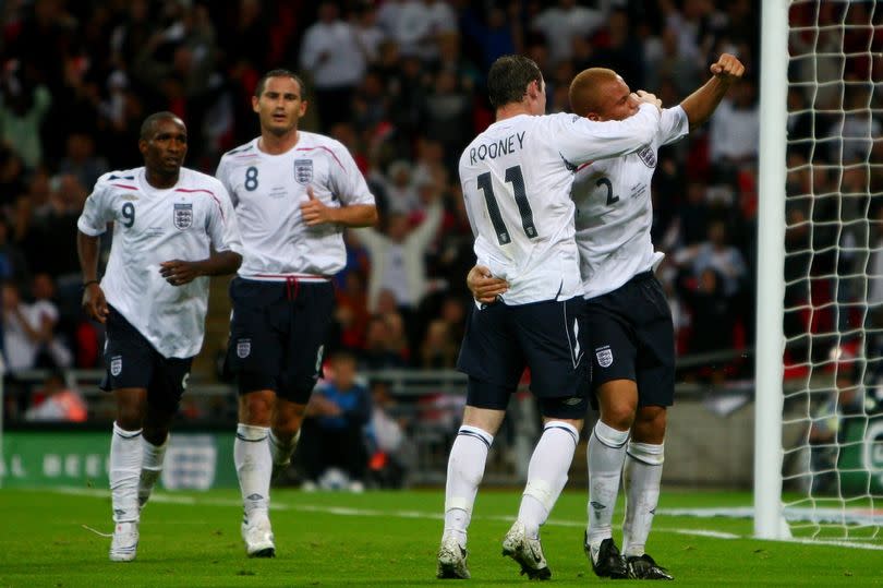 Wes Brown of England celebrates with Wayne Rooney of England after Brown scored during the international friendly match between England and the Czech Republic at Wembley Stadium on August 20, 2008