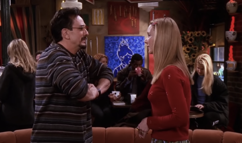 Phoebe and David standing in Central Perk