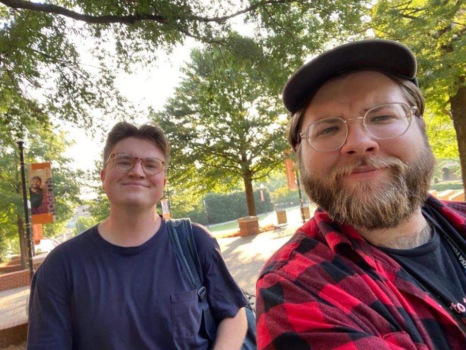 Reporters Daniel Dassow, left, and Keenan Thomas on the University of Tennessee at Knoxville campus testing if it is faster to park or walk from nearby student housing areas.