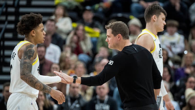 Utah Jazz coach Will Hardy slaps hands with Utah Jazz guard Keyonte George, left, during game Saturday, Dec. 2, 2023, in Salt Lake City.