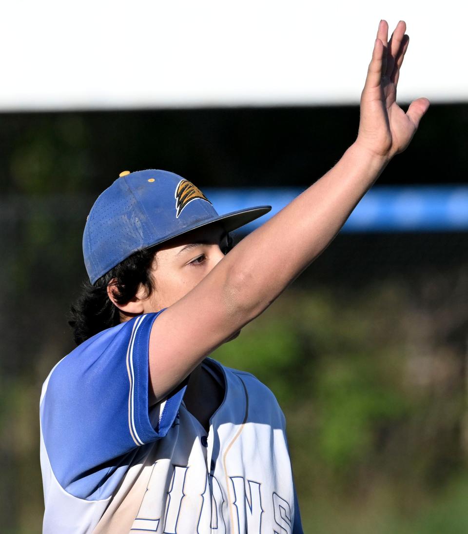 St. John Paul II pitcher Ty Reed waves to the Sturgis players at the end of the game on Wednesday, May 3, 2023.