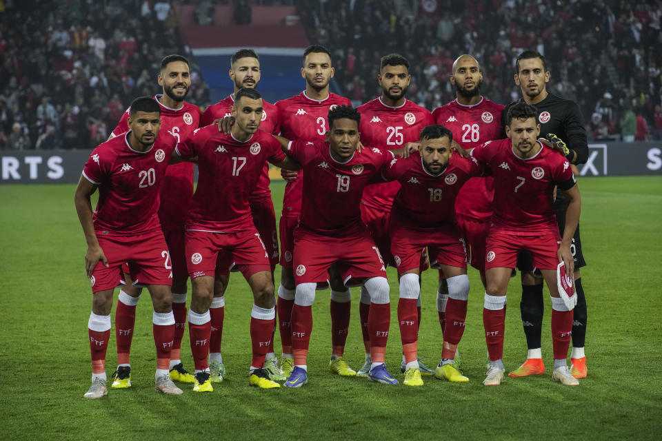 Tunisia players pose for a team picture during the international friendly soccer match between Brazil and Tunisia at the Parc des Princes stadium in Paris, France, Tuesday, Sept. 27, 2022. (AP Photo/Christophe Ena)