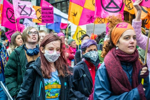 <span class="caption">A climate action march in London, February 2020, before the onset of lockdown.</span> <span class="attribution"><a class="link " href="https://www.shutterstock.com/image-photo/londonengland-february-22-2020-extinction-rebellion-1660268761" rel="nofollow noopener" target="_blank" data-ylk="slk:JessicaGirvan1/Shutterstock;elm:context_link;itc:0;sec:content-canvas">JessicaGirvan1/Shutterstock</a></span>