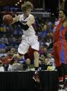 Stanford's John Gage (40) prepares to the throw the ball at Dayton's Jalen Robinson (12) during the first half in a regional semifinal game at the NCAA college basketball tournament, Thursday, March 27, 2014, in Memphis, Tenn. (AP Photo/Mark Humphrey)