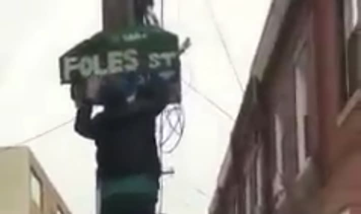 Eagles fans staple a homemade “Foles Street” sign onto an actual street sign in Philadelphia. (Twitter/@ubiqlife)