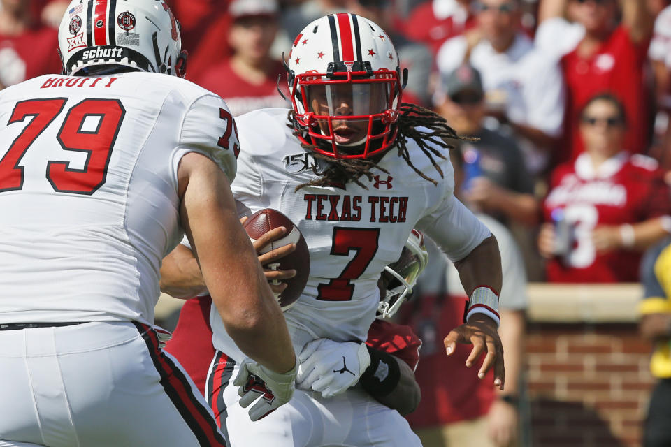 Texas Tech quarterback Jett Duffey (7) is brought down from behind by Oklahoma linebacker Kenneth Murray (9) in the first quarter of an NCAA college football game in Norman, Okla., Saturday, Sept. 28, 2019. (AP Photo/Sue Ogrocki)