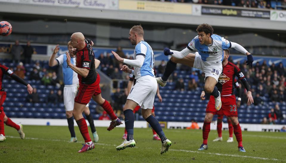 Blackburn Rovers' Rudy Gestede (2nd R) scores his team's second goal during their FA Cup fourth round soccer match against Swansea City at Ewood Park in Blackburn, northern England January 24, 2015. REUTERS/Andrew Yates (BRITAIN - Tags: SPORT SOCCER)