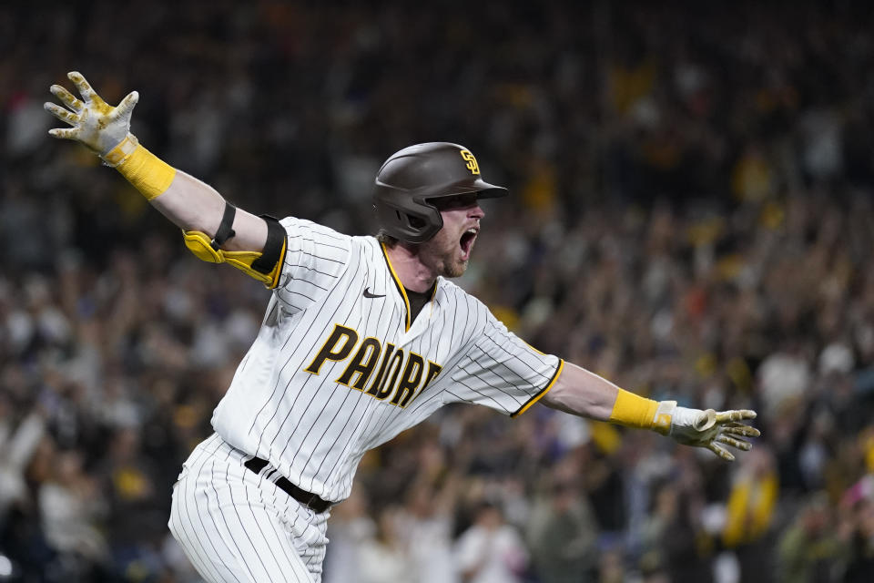 San Diego Padres' Jake Cronenworth reacts after hitting a two-run single during the seventh inning in Game 4 of a baseball NL Division Series against the Los Angeles Dodgers, Saturday, Oct. 15, 2022, in San Diego. (AP Photo/Ashley Landis)