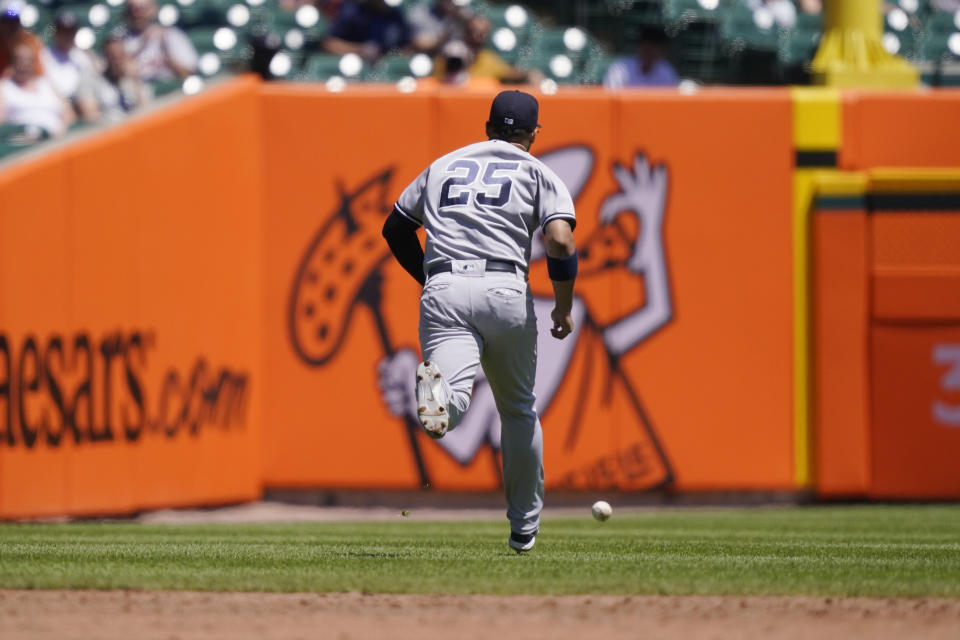 New York Yankees shortstop Gleyber Torres misplays the ball hit by Detroit Tigers Victor Reyes during the third inning of a baseball game, Sunday, May 30, 2021, in Detroit. (AP Photo/Carlos Osorio)
