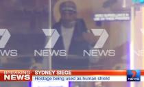 This screengrab taken from Australian Channel Seven shows the suspected gunman inside a cafe in the central business district of Sydney on December 15, 2014