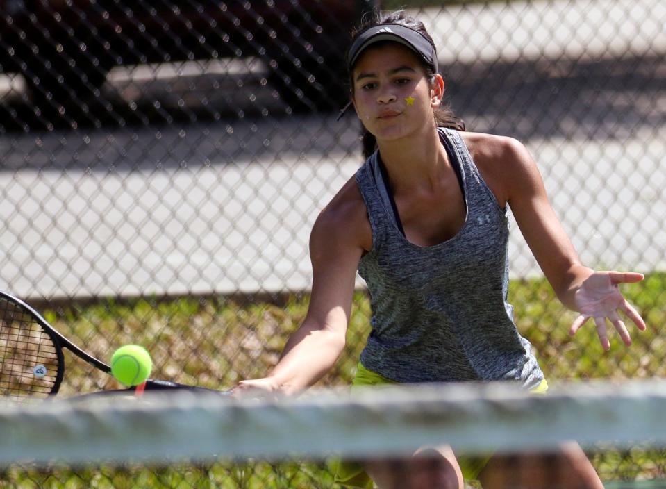 Auburndale junior Camila Guilarte hits a forehand back to Orlando Edgewater's Alynn Richards at their No. 3 singles match on Thursday in the Class 3A region finals.