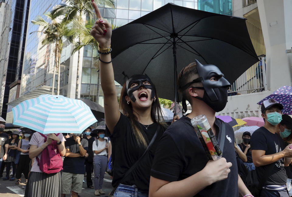 Masked protesters march in Hong Kong on Saturday, Oct. 5, 2019. All subway and trains services are closed in Hong Kong after another night of rampaging violence that a new ban on face masks failed to quell. (AP Photo/Vincent Yu)