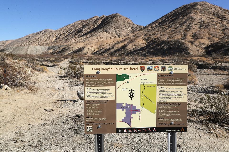 A sign informs visitors about the Long Canyon Trailhead that starts in Desert Hot Springs and goes to Joshua Tree National Park, December 3, 2021. 