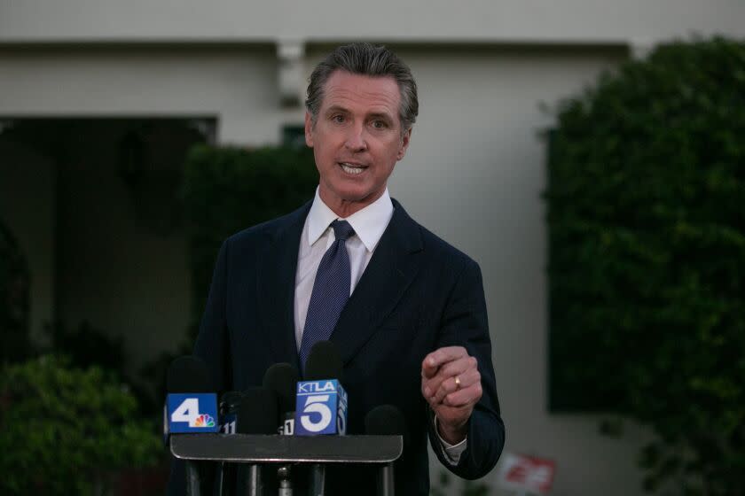 SAN MARINO, CA - JANUARY 23: Gavin Newsom visits with Brandon Tsay who disarmed the gunman who opened fire at a ballroom dance studio in Monterey Park on Monday, Jan. 23, 2023 in San Marino, CA. (Jason Armond / Los Angeles Times)