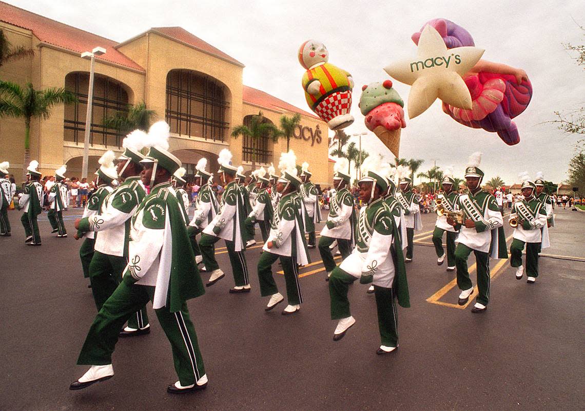 In this file photo from Oct. 9, 1996, Macy’s at The Falls opened to a parade with musicians, balloons and fanfair. One of the bands was from Miami Central High.