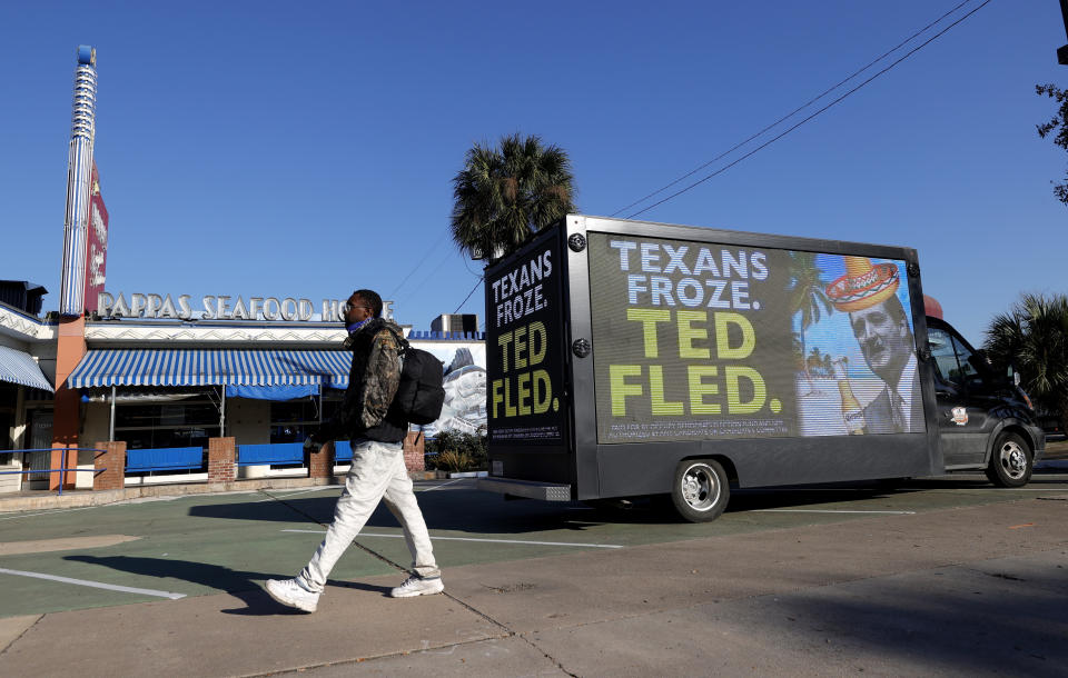A digital billboard truck in Houston calls out Sen. Ted Cruz (R-Texas) for going to Mexico as a deadly winter storm struck his state.  (Photo: Justin Sullivan/Getty Images)