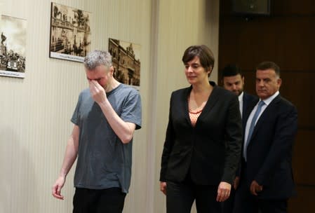 Canadian citizen, Kristian Lee Baxter, who was being held in Syria reacts as he walks next to Canadian Ambassador to Lebanon, Emmanuelle Lamoureux and Major General Abbas Ibrahim, Lebanon's internal security chief, after being released, in Beirut