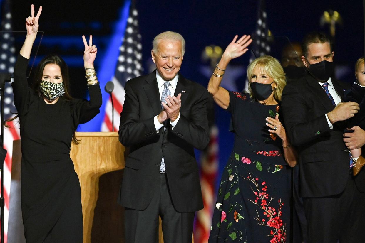 Ashley Biden, daughter of Joe Biden, US President-elect Joe Biden, wife Jill Biden and Hunter Biden salute the crowd after delivering remarks in Wilmington, Delaware, on November 7, 2020, after being declared the winner of the presidential election.