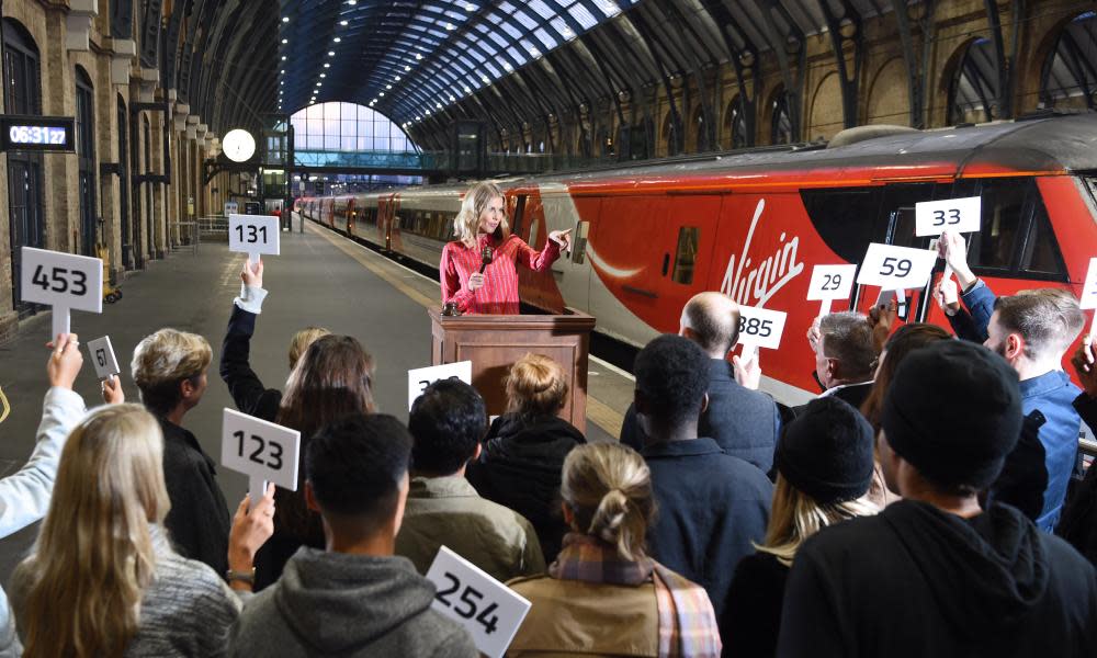 The launch of Virgin's seat upgrade auction app at King's Cross station in London